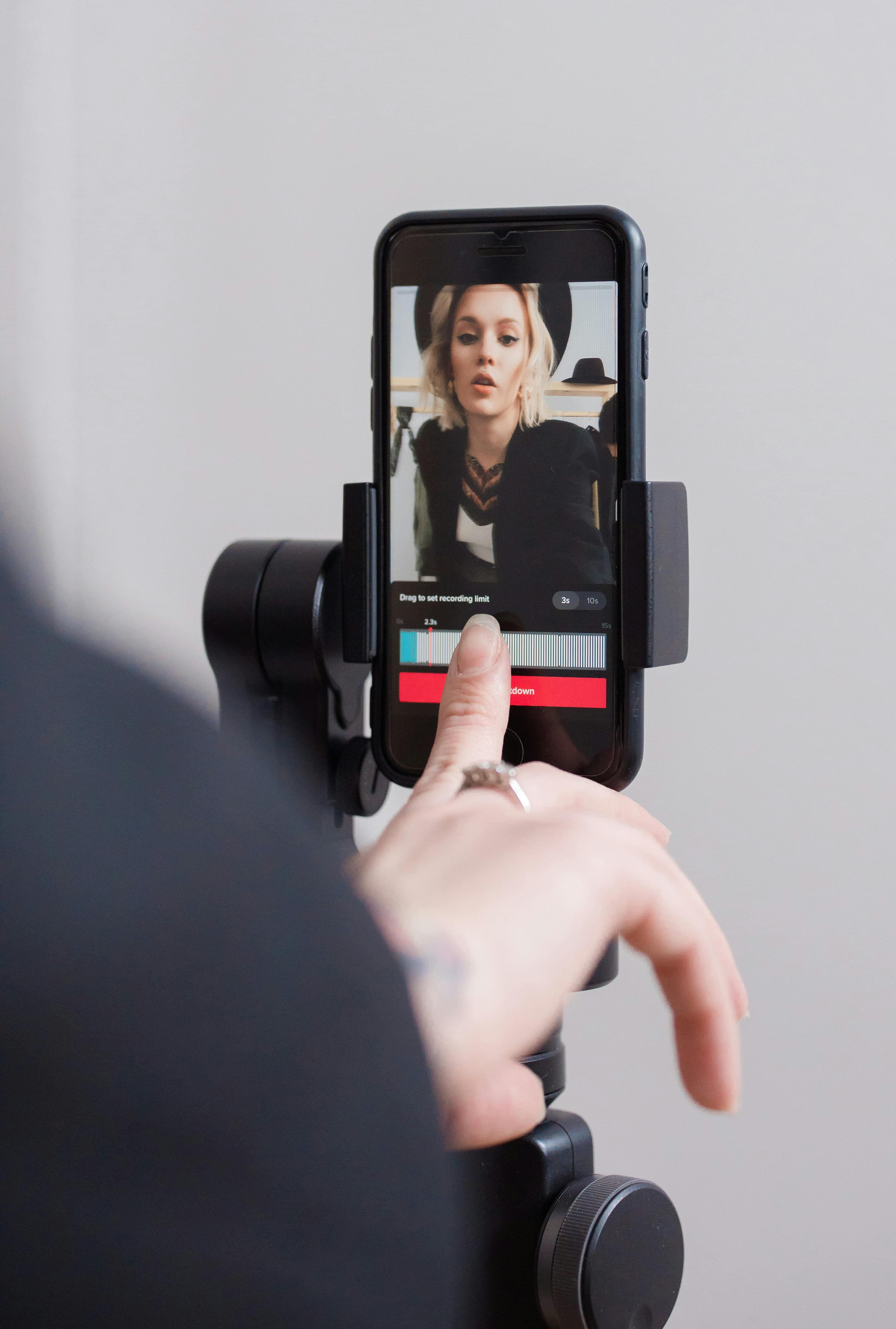 A creator recording a vertical video on a smartphone